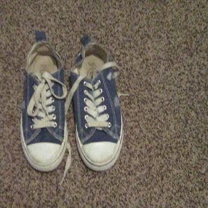 Ripped blue jean shoes